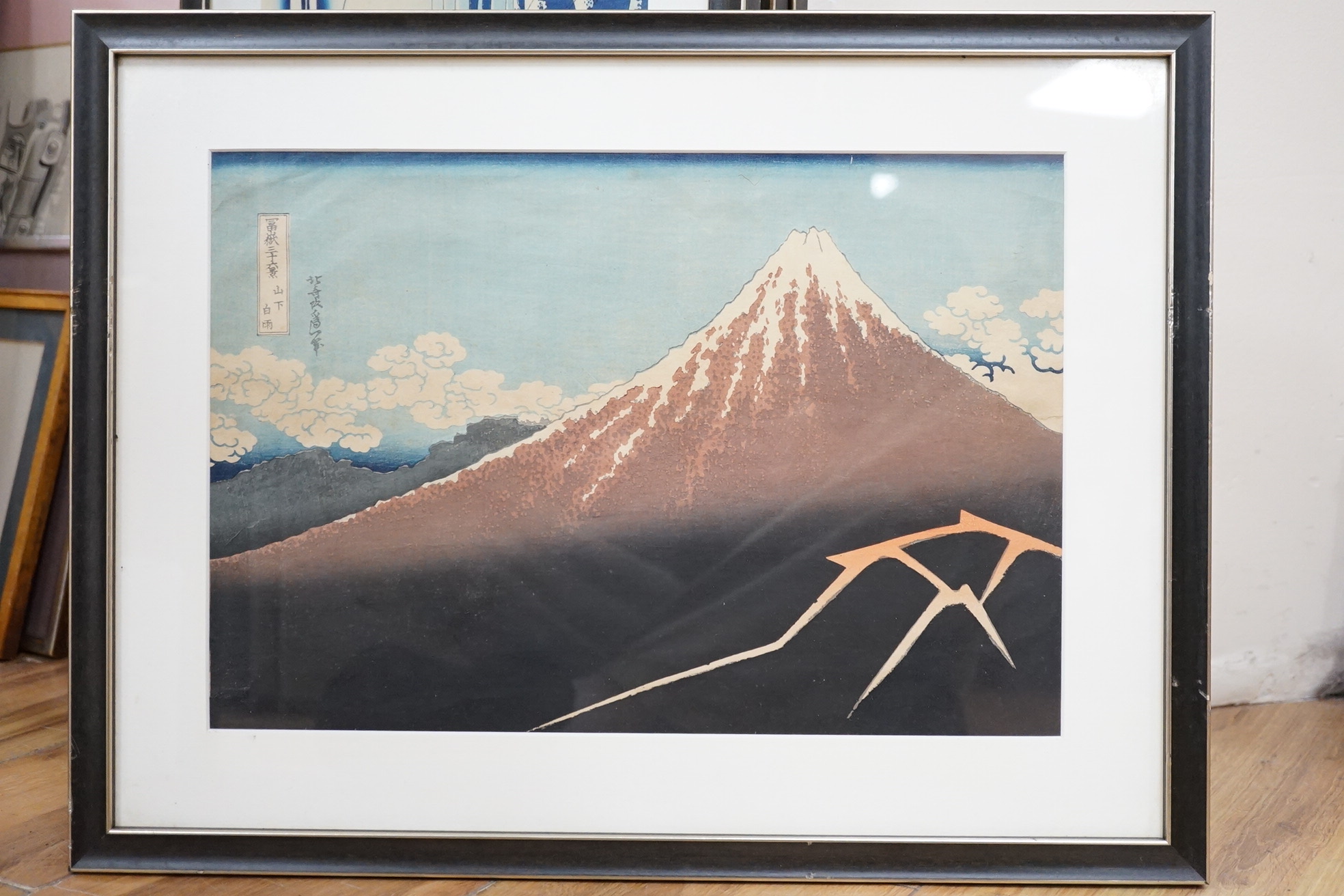 A set of ten Japanese woodblock prints to include ‘Great wave off the coast of Kanagawa’, ‘Fishermen at Kajikazawa’ and ‘Evening shower’, largest 25 x 36cm. Condition - fair